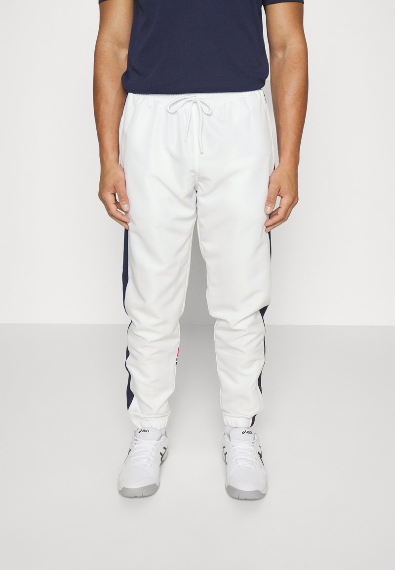 Men’s Long trousers | Sergio Tacchini DEN PANT – Tracksuit bottoms – white/adrenaline rush/white – KD60568