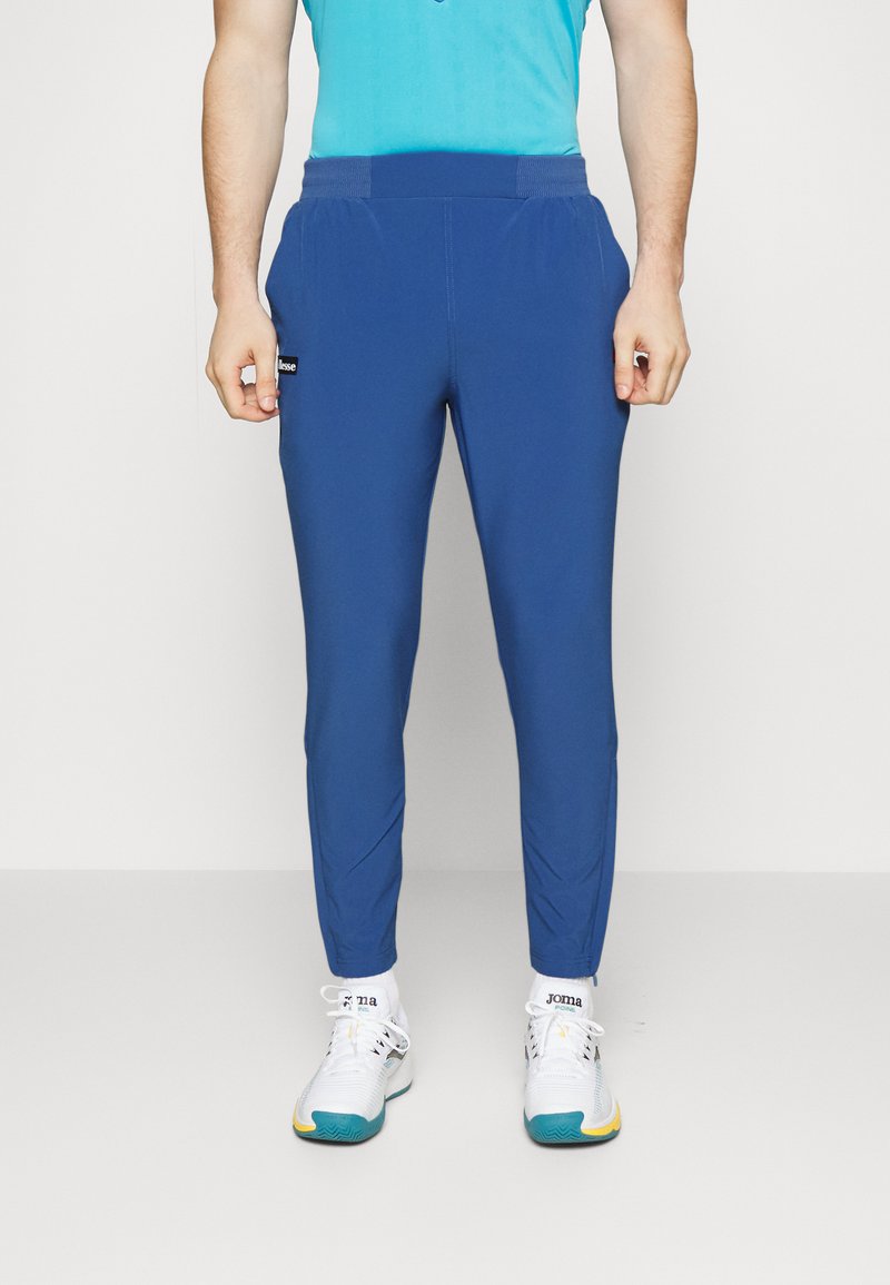Men’s Long trousers | Ellesse DEBILLY – Tracksuit bottoms – blue – VL86122