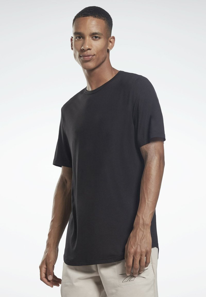 Men’s T-Shirts | Reebok ACTIVCHILL DREAMBLEND  – Basic T-shirt – black – JT14965